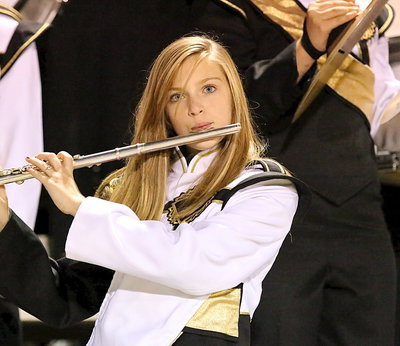 Image: Kristen Viator plays the flute for the Gladiator Marching Band during homecoming.