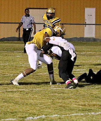 Image: Safety Trevon Robertson(3) slings down a Cayuga runner.