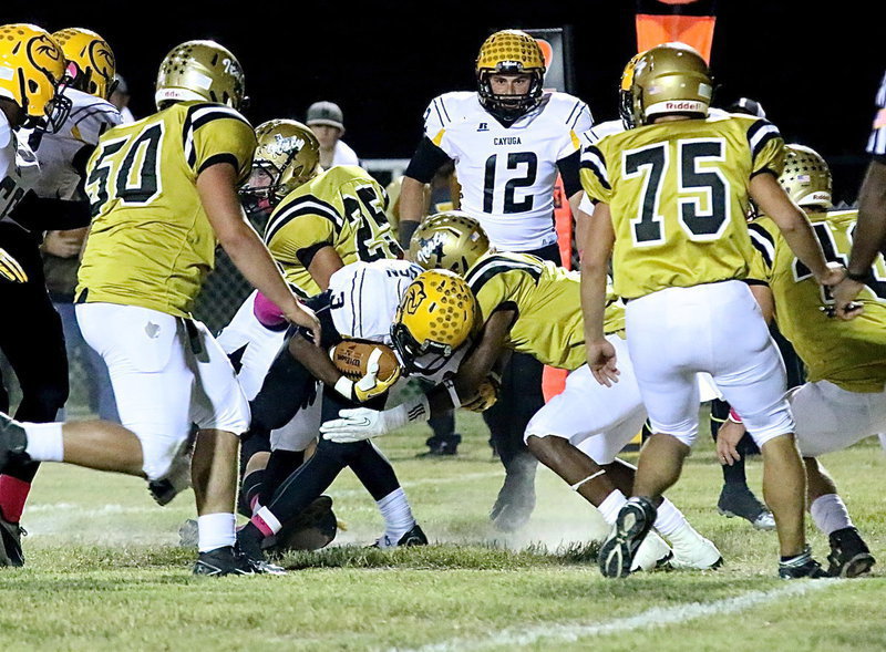 Image: Trevon Robertson(3) delivers a hit on a Cayuga running back. Robertson had 9 tackles (5 solos) in the game.