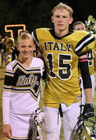 Image: Junior high cheerleader Taylor Boyd poses with her Gladiator big brother Cody Boyd(15) to capture a homecoming memory.
