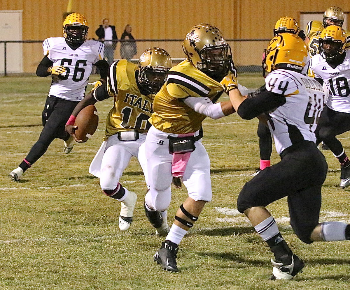 Image: TaMarcus Sheppard(10) finds room to run against Cayuga behind tight-end Levi McBride(1) to help Italy celebrate Homecoming 2013 with a 42-14 victory over the Wildcats.