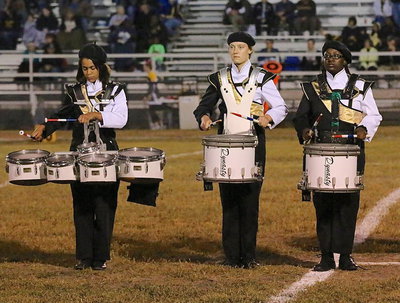 Image: Alexis Minton, drumline captain Whitney Wolaver and Brenya Williams entertain the homecoming crowd.