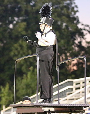 Image: Senior drum major Emily Stiles guides the band through parts of their homecoming routine.