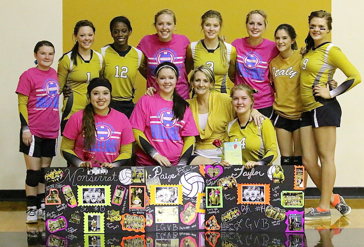 Image: One last group photo with the the 2013-2014 seniors as Monserrat Figueroa(15), Paige Westbrook(11), head coach Morgan Mathews and Taylor Turner(14) pose with their teammates along the back row which includes, Tara Wallis(5), Bailey Eubank(1), Kortnei Johnson(12), Jaclynn Lewis(13), Halee Turner(3), Madison Washington(10), Cassidy Childers(2) and Lillie Perry(9).