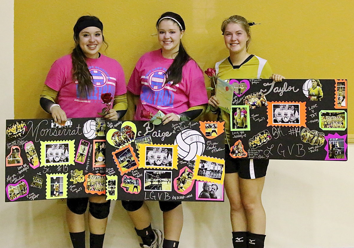 Image: Senior Lady Gladiators’ Monserrat Figueroa, Paige Westbrook and Taylor Turner display their poster photo collages, cards and roses each received while being honored following their final home game inside Italy Coliseum.