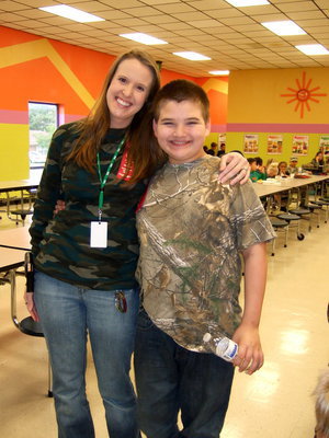 Image: Angela Chambers (CBI teacher) and Wyatt Ballard enjoy wearing their “Camo.”