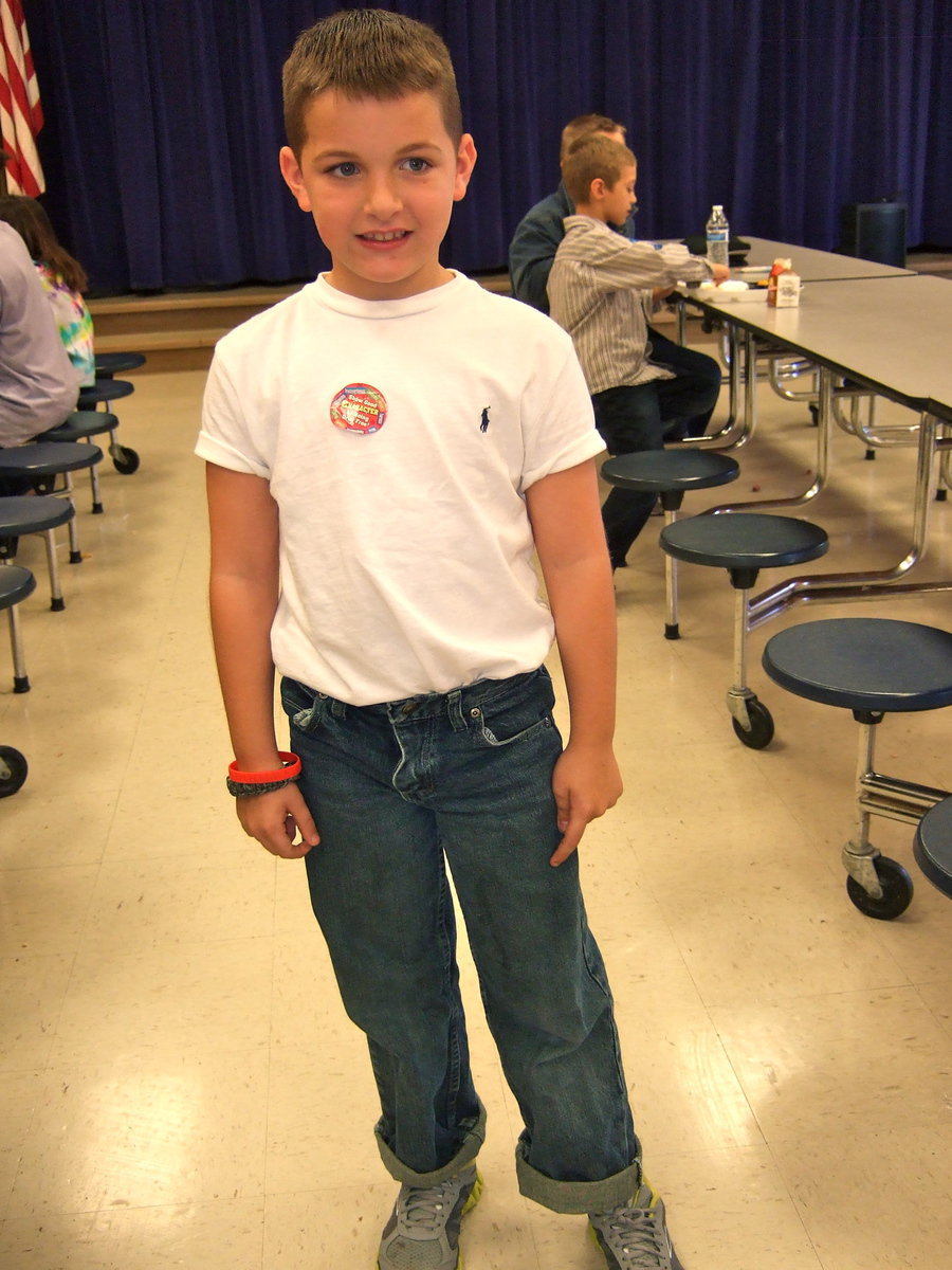 Image: Rolled up pants and rolled up sleeves makes this fellow look like he is back in the fifties.