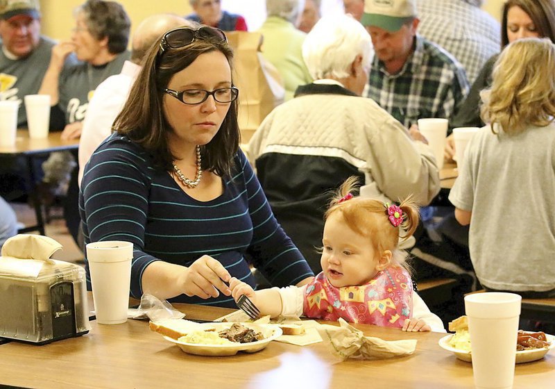 Image: All ages attend the dinner to raise scholarship money for selected Italy High school graduates. Mary Beth and Whitley Wainscott enjoy their meal.