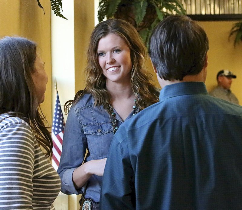 Image: Kaitlyn Rossa visits with Jon and Diana Herrin.