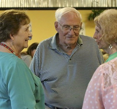Image: Tom and Barbara Little visit with their friend, Wanda Scott. The Littles’ granddaughter Kaitlyn Rossa is attending college with the help of the scholarship.