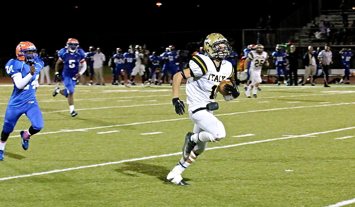 Image: With just over a minute on the clock and his team down 24-21, Italy Gladiator sophomore receiver Levi McBride(1) is hit in stride by quarterback TaMarcus Sheppard for a 69-yard game winning touchdown against Dallas Gateway. McBride’s heroics improved Italy’s district mark to 4-0 and gives them sole possession of 1st Place with one game remaining.