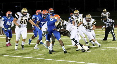 Image: Coby Bland(40) and TaMarcus Sheppard(10) hunt down a Gator ball carrier.