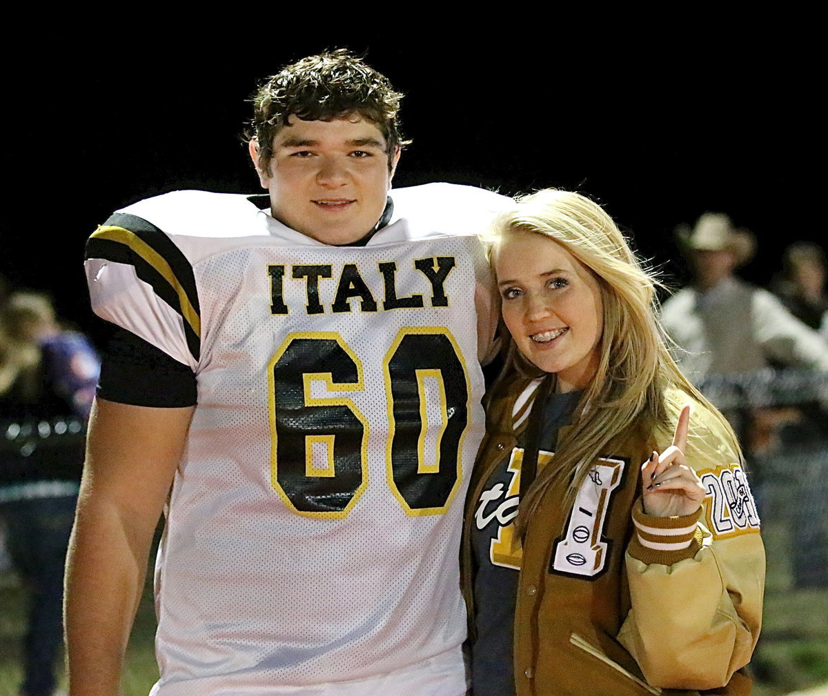 Image: Stat Squad girl Hannah Washington congratulates Kevin Roldan(60) after the game.