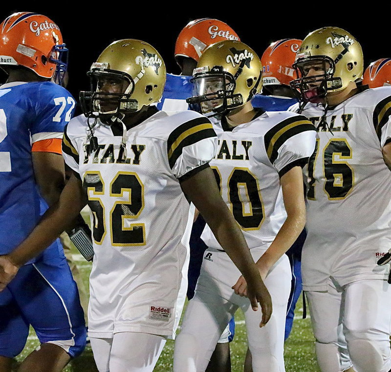 Image: Kenneth Norwood, Jr. (62), Hunter Ballard(30) and Colin Newman(76) show good sportsmanship after the game.