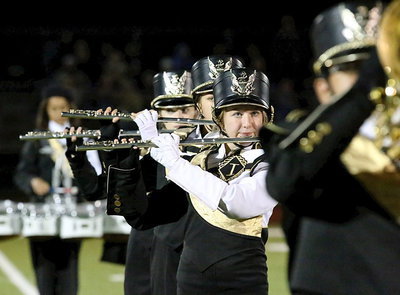 Image: Rachel Huskins with her flute mates during halftime.