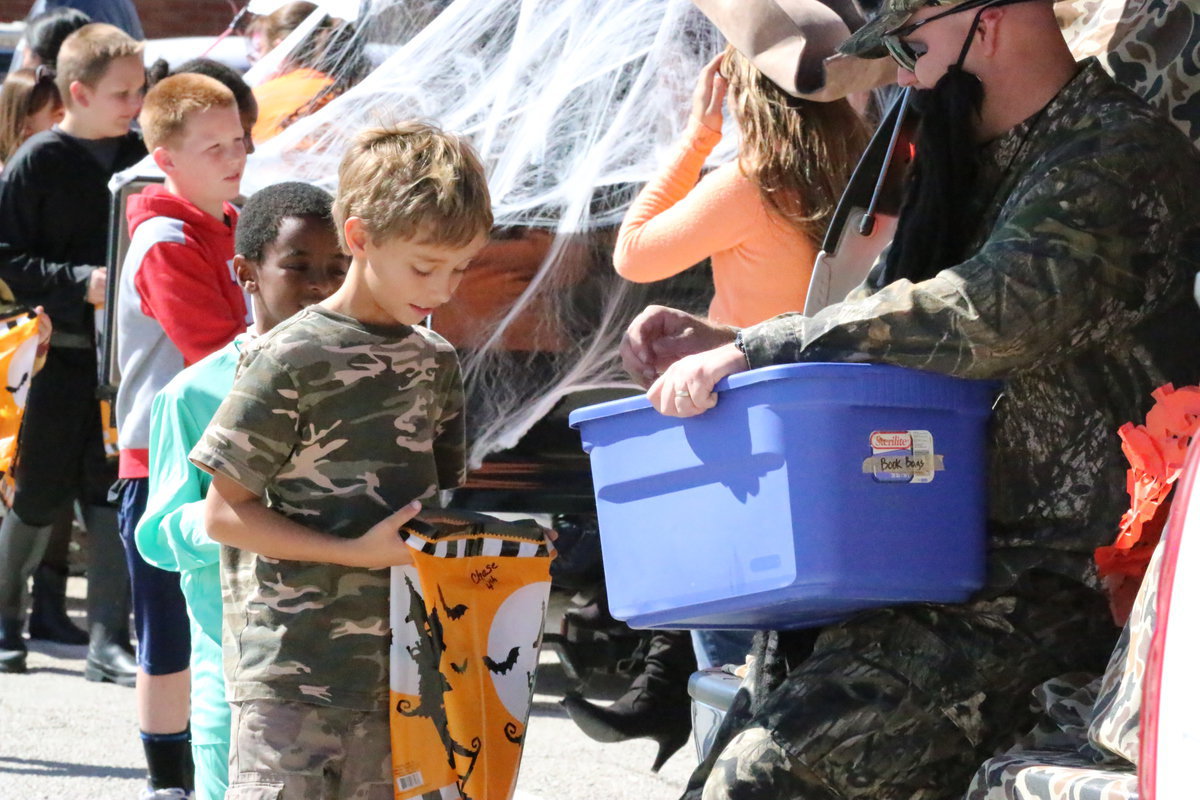 Image: Chase Hyles checks on his bag of goodies.