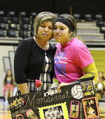 Image: Senior honoree, Monserrat Figueroa(15) is consoled by her mother, Blanca Figueroa, during the Senior Day presentation following the game against Frost.
