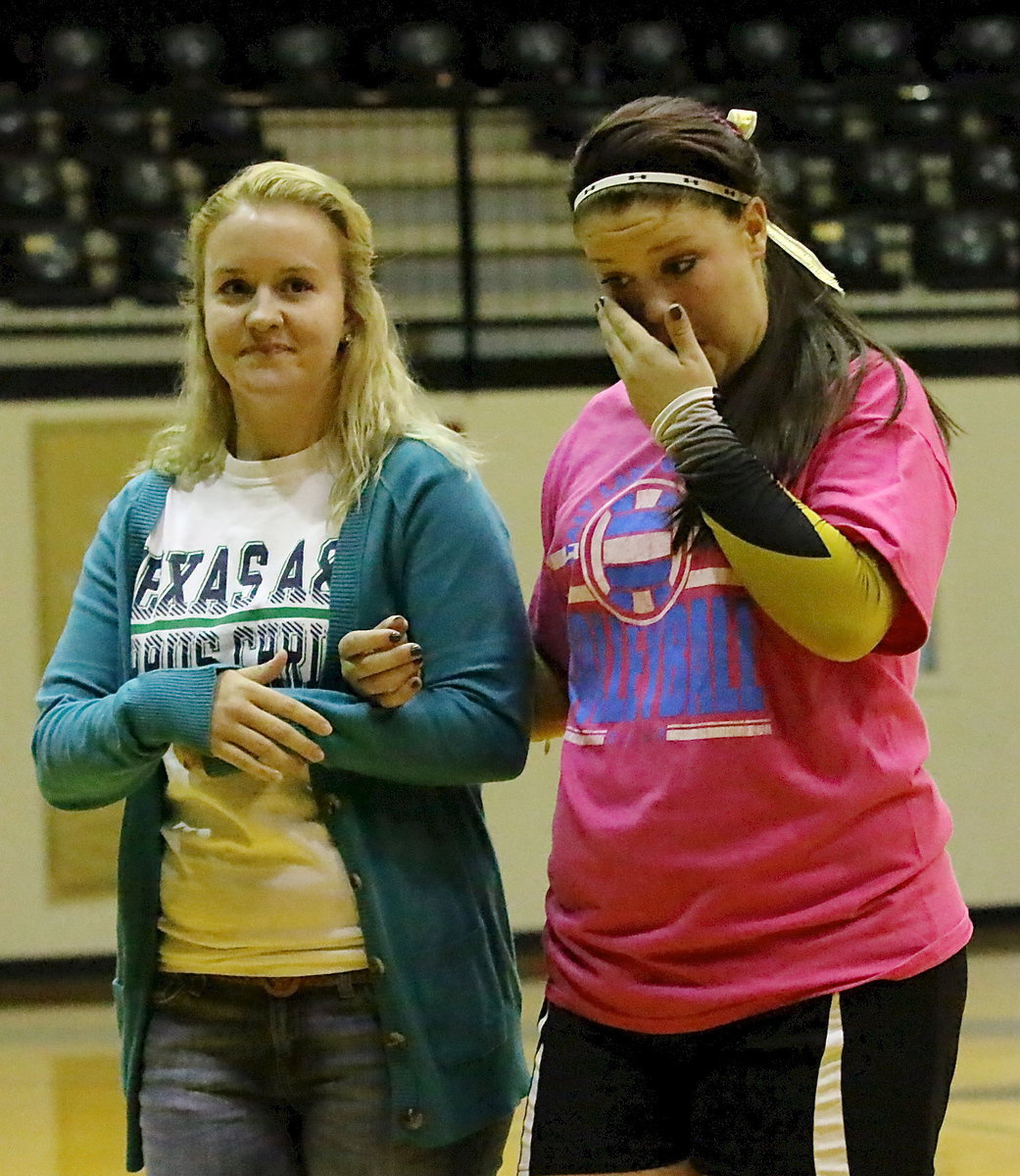 Image: Senior Lady Gladiator, Paige Westbrook(11), is escorted by her sister and Italy alumni, Courtney Westbrook, during the Senior Day presentation following the game against Frost.