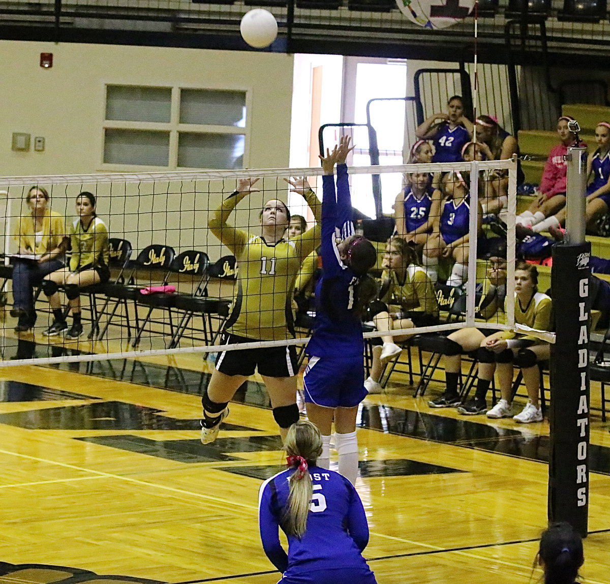 Image: Lady Gladiator Paige Westbrook(11) goes airborne for the return against Frost during her final home game as a senior.