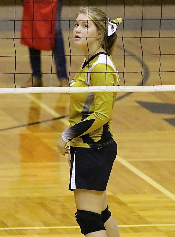 Image: Lady Gladiator Taylor Turner(14) tracks the path of a Frost serve during her final home game as a senior.