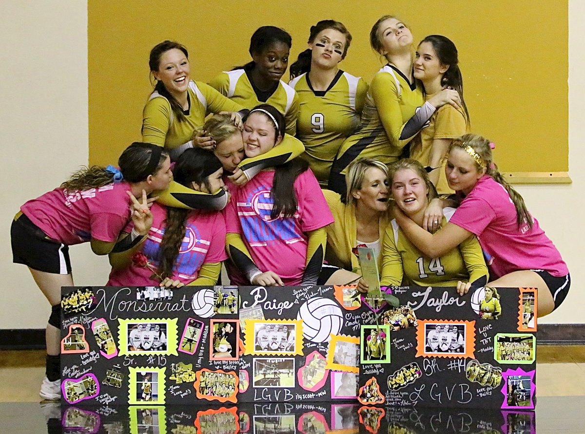 Image: One last silly group photo with the the 2013-2014 seniors as Monserrat Figueroa(15), Paige Westbrook(11) and Taylor Turner(14) share a light moment with head coach Morgan Mathews and teammates Tara Wallis(5), Bailey Eubank(1), Kortnei Johnson(12), Lillie Perry(9), Halee Turner(3), Cassidy Childers(2), Jaclynn Lewis(13) and Madison Washington(10).