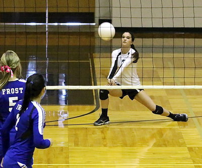 Image: Cassidy Childers(2) gets under the serve from Frost.