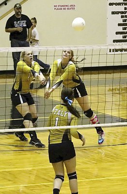 Image: Jaclynn Lewis(13) and Madison Washington(10) team up to return the volley.