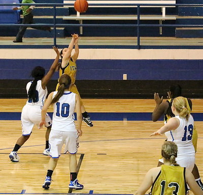 Image: Lady Gladiator guard Tara Wallis(4) knocks down one of her two made three-pointers against Blooming Grove.