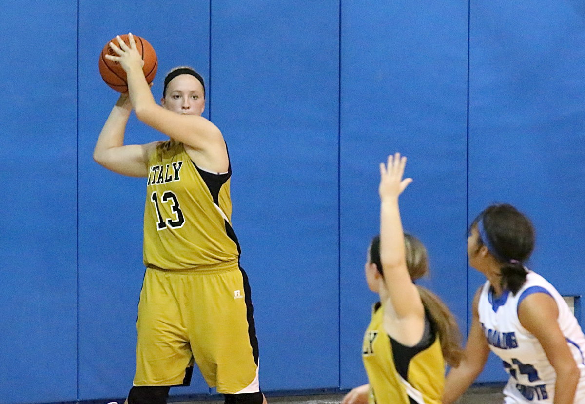 Image: Jaclynn Lewis(13) looks to inbound to teammate Tara Wallis(4).