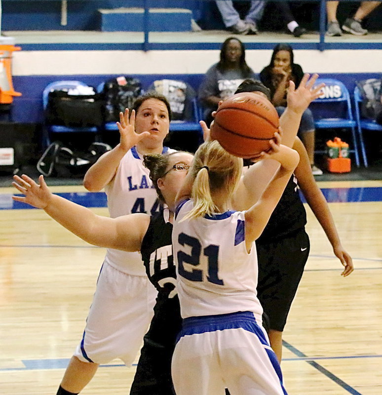 Image: Rebekah Corley(24) denies a Blooming Grove pass attempt.