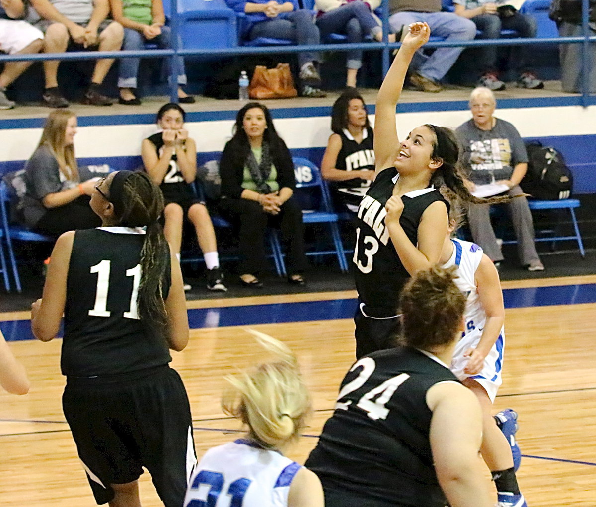 Image: Italy’s JV Lady Gladiators had plenty to smile about as Ashlyn Jacinto(13) lofts up a happy shot against Blooming Grove.