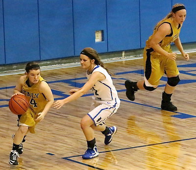Image: Jaclynn Lewis(13) inbounds the ball to Tara Wallis(4) who pushes the ball up court with gusto!