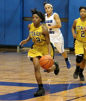 Image: Kendra Copeland(10) hurries the ball up the floor with teammate Bernice Hailey(2) tracking the ball.