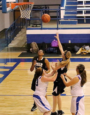 Image: Halee Turner(5) put up a shot with teammate Oleshia Anderson(11) in good rebounding position.