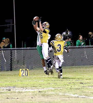 Image: Cornerback Cody Boyd(15) intercepts a Bobcat pass attempt with teammate Trevon Robertson(3) hustling over to assist.