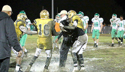 Image: Gladiator head coach Charles Tindol gets the ceremonial Gatorade bath from seniors Trevon Robertson, TaMarcus Sheppard and Darol Wayne Mayberry after Italy KOs Kerens 33-7 to win the championship outright with a 5-0 undefeated record in district.
