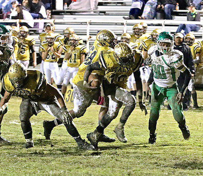 Image: Blockers Coby Bland(40) and Darol Mayberry(58) show teammate TaMarcus Sheppard(10) the way to the end zone.