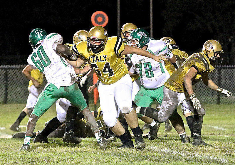 Image: JV offensive tackle Austin Pittmon(64) introduces himself to a Kerens varsity defender.