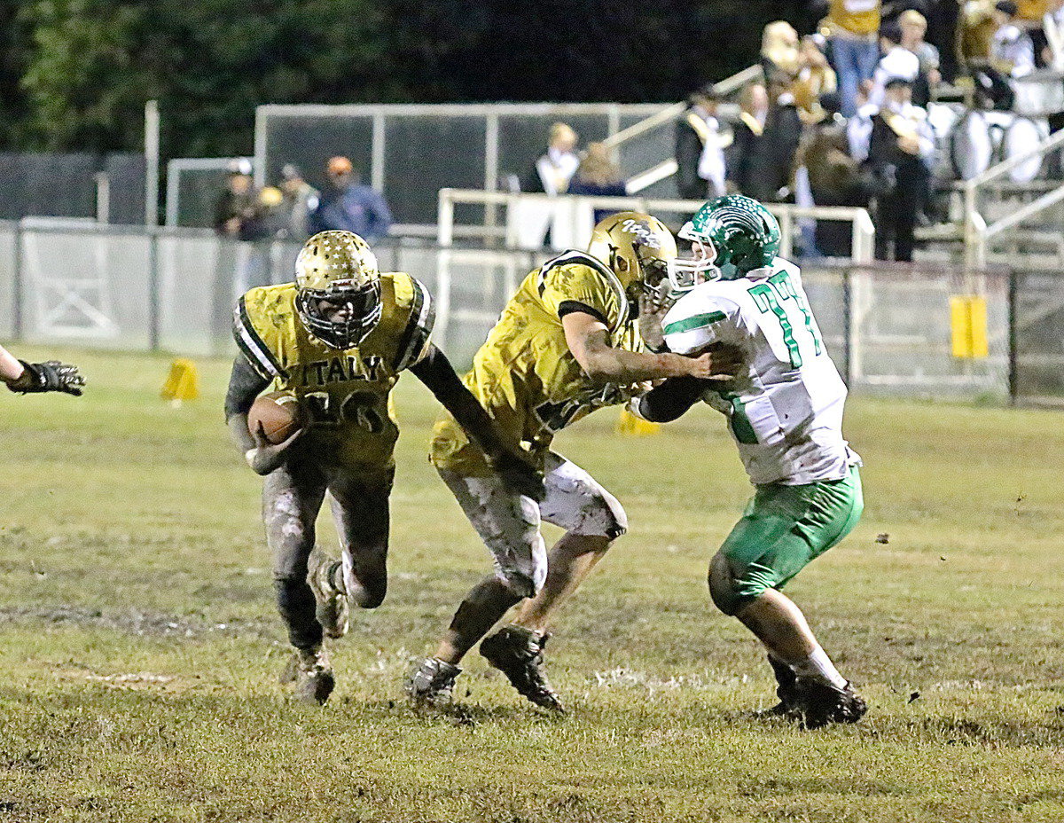 Image: Cody Medrano(75) kicks out a Bobcat defenseman allowing TaMarcus Sheppard(10) to cut underneath the block.