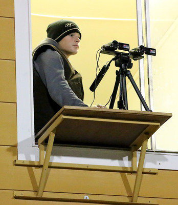 Image: Team videographer Clay Riddle stays focused on the game.