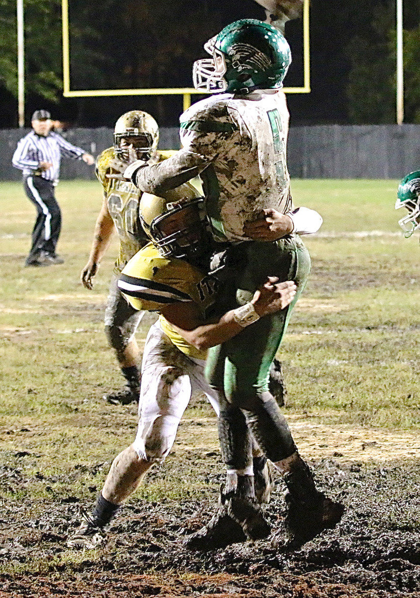 Image: Gladiator senior defensive end Bailey Walton(54) nearly scores a safety but has to settle for forcing an incomplete pass.