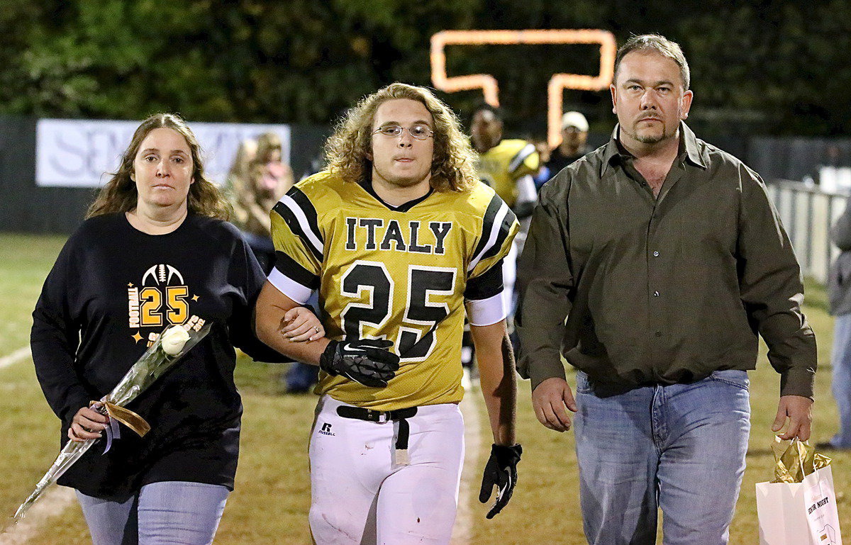 Image: Gladiator senior Shad Newman(25) is the son of Laura Tuck and Michael Newman. The “Shadiator” is being escorted by his aunt and uncle, Robin Dodson and Paul Dodson.