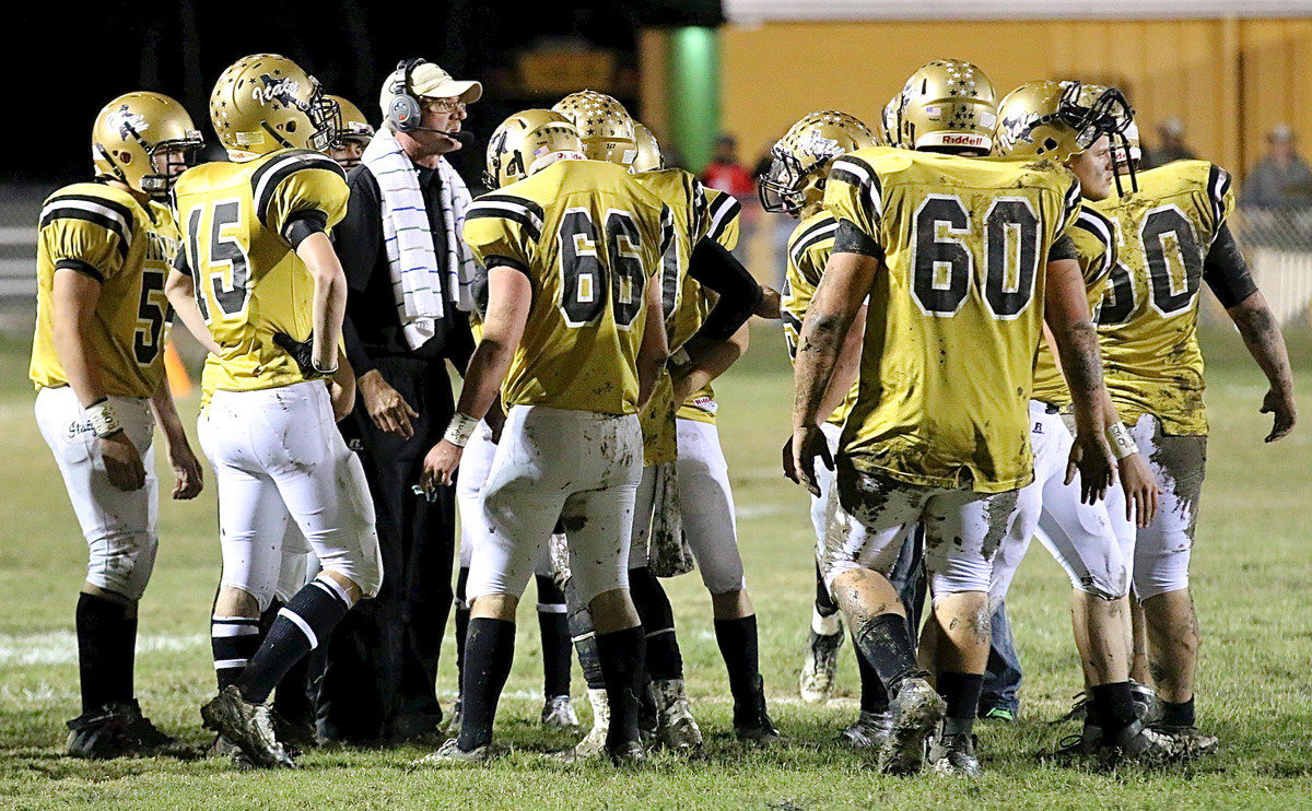 Image: Gladiator head coach Charles Tindol talks with his men during a timeout.