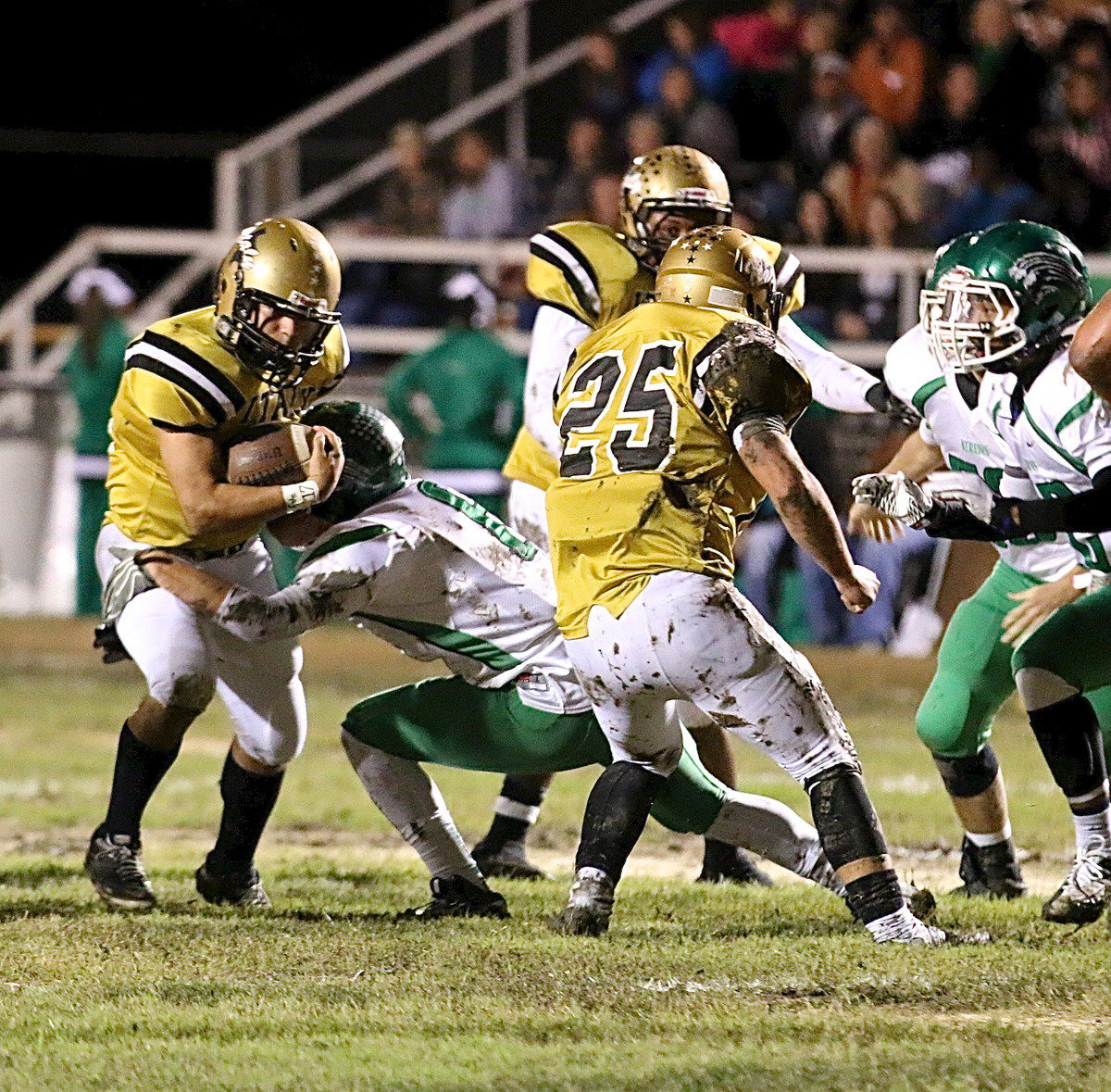 Image: Tyler Anderson(11) breaks a tackle and then gets in behind fullback Shad Newman(25) for extra yards.