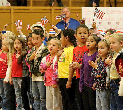 Image: Stafford Elementary kindergarteners and 1st graders sing Grand Old Flag on behalf of the veterans.