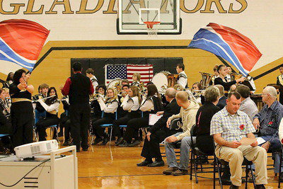 Image: Band director Jesus Perez leads the band in the playing of that great American folk song, Shenandoah, as the color guard enhances the moment.