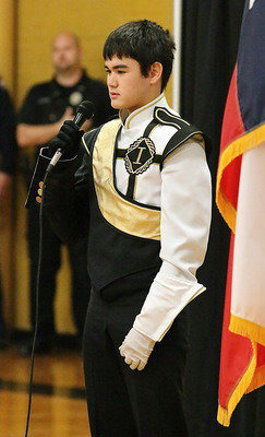 Image: The singing voice of Gladiator Regiment Band member Kyle Tindol is more than enough as he delivers the National Anthem.