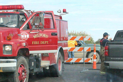 Image: The Milford Fire Department sets up a traffic check point.