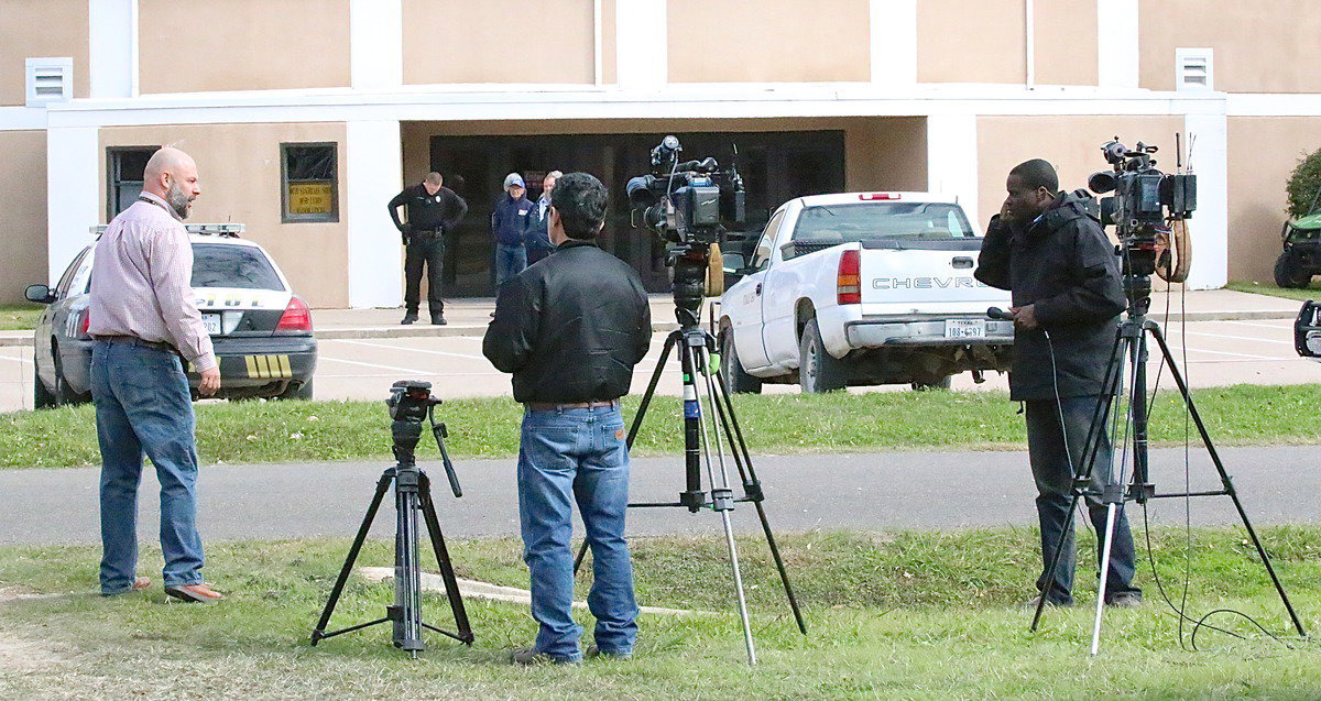 Image: Italy HS principal Lee Joffre checks in with camera crews posted up outside the Coliseum.