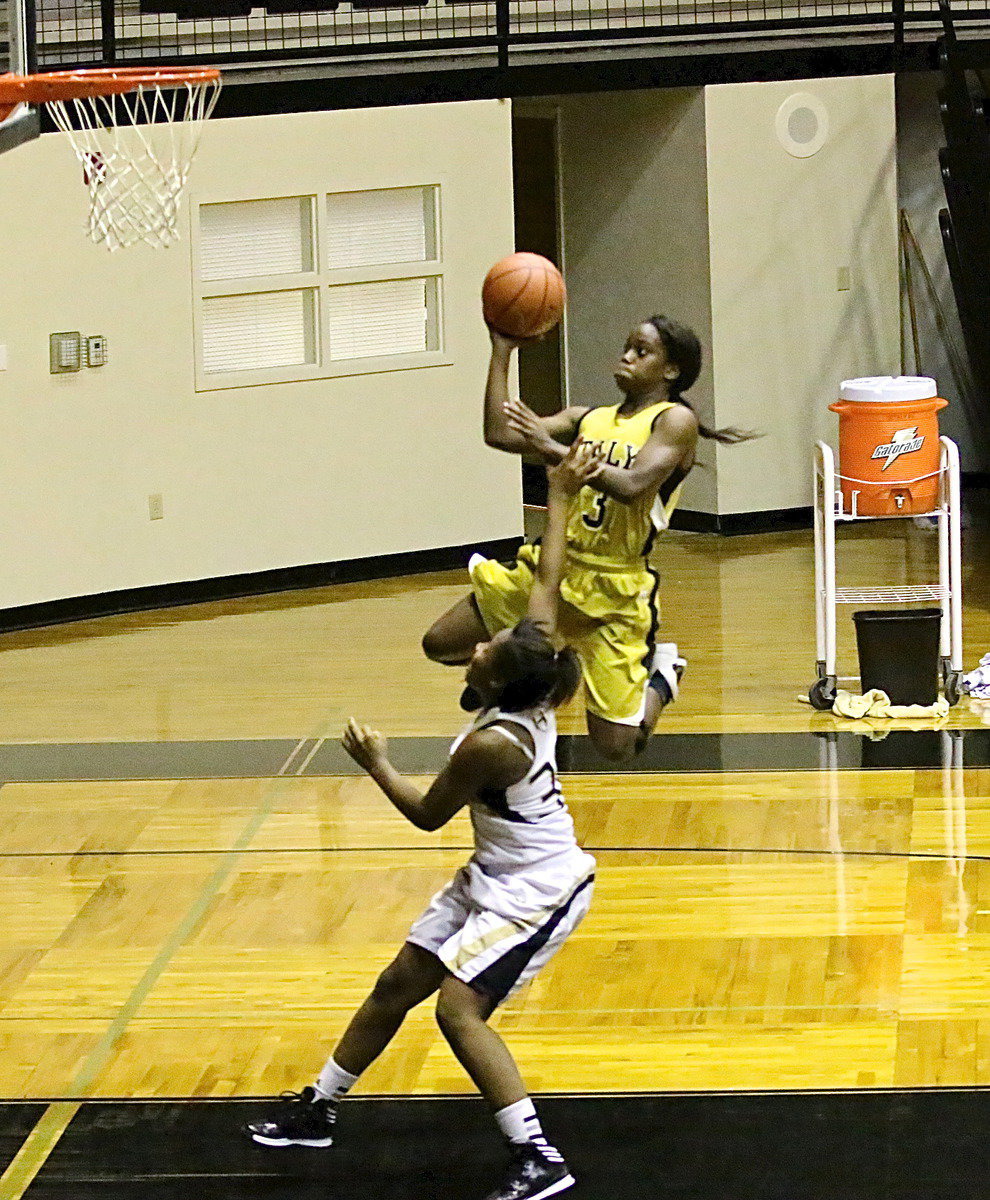 Image: Lady Gladiator Kortnei Johnson(3) lifts off toward the rim over a Hubbard defender during Italy’s first home game inside Coliseum. The Lady Jaguars maintained an early lead to win 58-39.